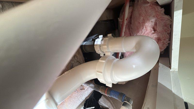 Replaced defective 2-inch P-trap assembly beneath bathroom sink with new PVC P-trap and fittings. Removed old trap configuration, cleaned drain connections, and installed new trap to proper code specifications. Verified proper drainage flow and sealed all connections to prevent leaks. All plumbing components are now functioning correctly with no drainage issues.