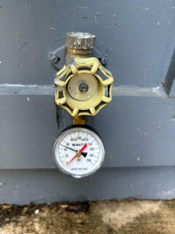Completed plumbing maintenance inspection for property pre-sale requirements. Evaluated and documented water pressure regulator assembly with gauge reading and condition of brass valve components. Inspected and photographed all accessible plumbing fixtures and pressure control systems to verify proper operation for homeowner's property transfer documentation.