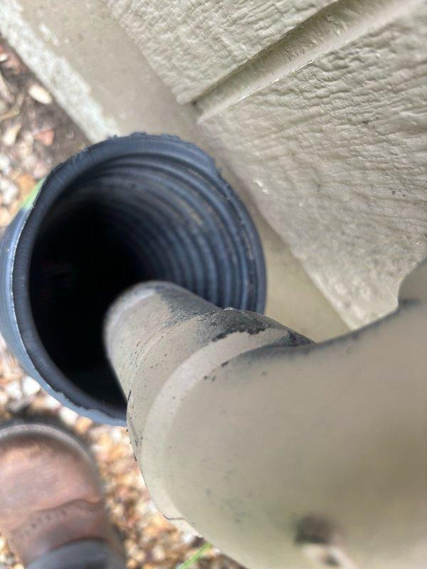Installed a dual sump pump system featuring a 1/2 HP energy-efficient permanent split capacitor (PSC) primary pump with capacity of 3,540 GPH at 10-foot lift and 4,400 GPH at zero lift, along with a backup pump system rated at 1,850 GPH at 10-foot lift and 2,500 GPH at zero lift. Routed discharge piping through foundation wall using corrugated flexible hose and connected to exterior drainage system with proper insulation at penetration point.