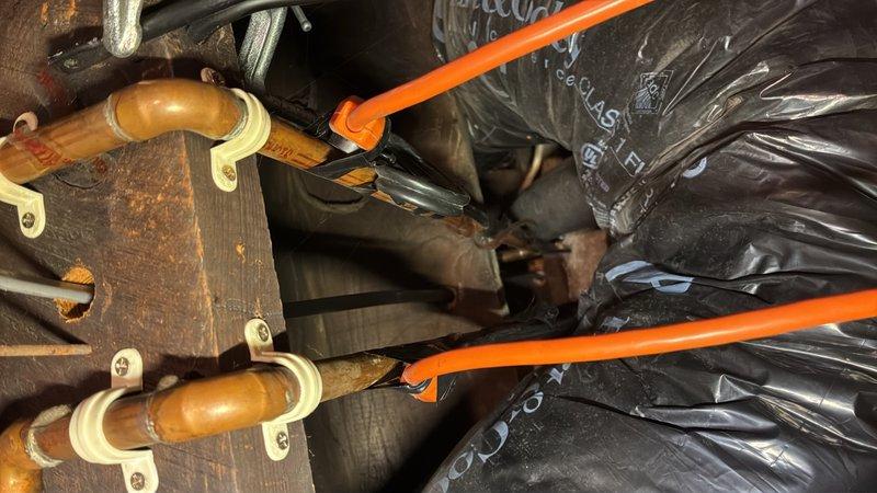 Performed camera inspection of main line and shut off valve in basement using RIDGID SeeSnak inspection equipment. Evaluated plumbing infrastructure including copper piping system with fittings and brackets mounted to structural beams, and assessed 4-inch Schedule 80 PVC pipe condition. Provided quote for shut off valve installation based on inspection findings.