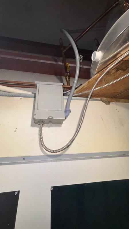 Removed existing commercial tank water heater and installed customer-supplied replacement unit in compliance with current plumbing and electrical codes. Installation included proper electrical disconnect switch with flexible metal conduit for safe service access, new water heater drain pan for leak protection, and thermal expansion tank with copper piping connections. All components were secured according to code requirements, with proper venting and safety labeling verified upon completion.