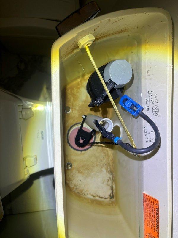 Responded to report of continuously running toilet on second floor. Upon inspection, diagnosed faulty fill valve causing constant water flow into tank. Replaced defective fill valve assembly with new unit, adjusted water level settings, and tested flush mechanism for proper operation. Verified braided stainless steel supply line connection at tank base for leaks and confirmed secure mounting. System now cycles correctly with no continuous running, restoring normal toilet function and eliminating water waste.