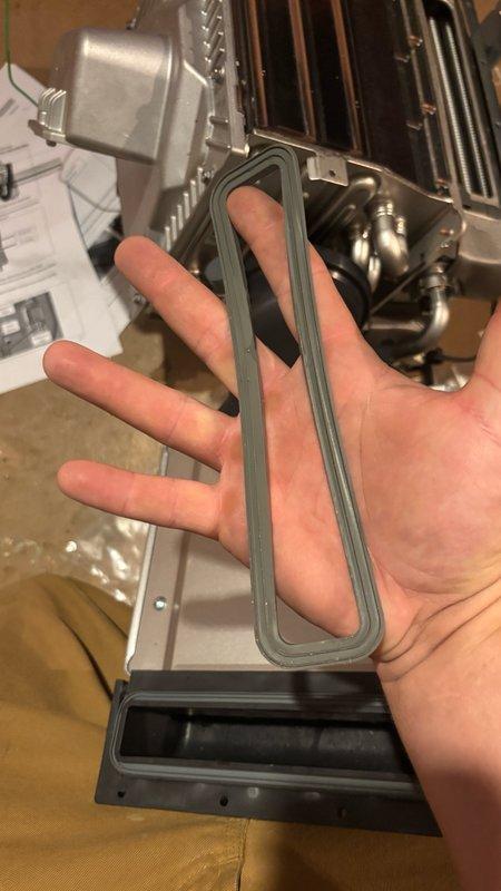 Replaced exhaust gasket on tankless water heater unit. Disassembled internal components to access exhaust tube assembly, removed defective gasket, and installed new warranty replacement gasket. Reassembled unit, restored all connections, and verified proper operation of the system.