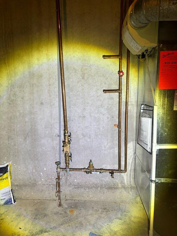 Completed scheduled plumbing maintenance inspection and addressed reported toilet leak. Evaluated shower system operation and water flow, confirming proper functionality of chrome multi-spray fixture and wall-mounted components. Inspected basement mechanical room plumbing infrastructure, including copper supply lines, shut-off valves, and connections to HVAC equipment. All systems tested and verified operational with no additional leaks detected.