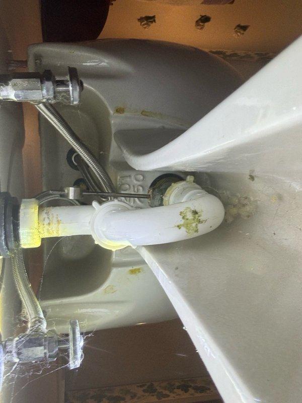 Completed recurring plumbing maintenance inspection at residential property. Evaluated water heater installation, verified proper connections and safety labels, and inspected bathroom sink drain assembly including P-trap and supply lines for leaks or deterioration.