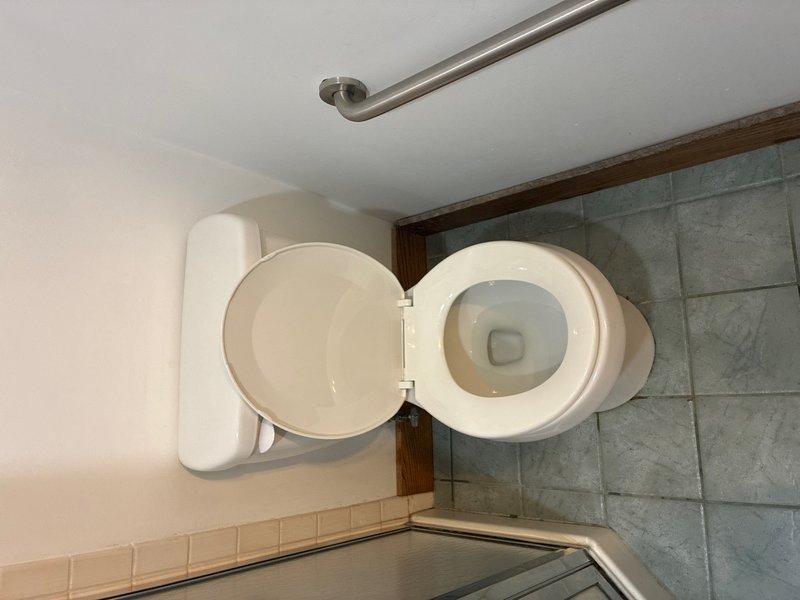 Completed toilet pull and reset service in half bathroom. Removed existing toilet fixture from floor flange, inspected wax ring and mounting hardware, and reinstalled toilet with new wax seal to ensure proper seating and leak-free operation.