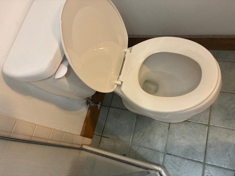 Completed toilet pull and reset service in half bathroom. Removed existing toilet fixture from floor flange, inspected wax ring and mounting hardware, and reinstalled toilet with new wax seal to ensure proper seating and leak-free operation.
