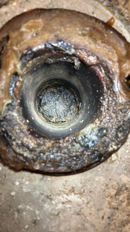 Performed hydro-jetting service on severely obstructed drainage line exhibiting extensive mineral scaling, corrosion buildup, and heavy deposits throughout the pipe interior. Utilized high-pressure water jetting equipment to clear significant accumulation of rust, mineral deposits, and debris that had substantially reduced the effective diameter of the line. Pre-service camera inspection documented heavy brown-orange corrosion products, white mineral scaling, and dark organic matter coating the pipe walls in multiple layers. Successfully restored flow capacity by removing crusty buildup and accumulated sediment from the full length of the affected section.