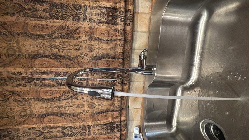 Responded to service call for dripping kitchen faucet. Upon inspection, identified leak from faucet assembly requiring repair. Accessed under-sink plumbing components and shut off water supply. Replaced worn internal cartridge and seals causing the drip. Tested faucet operation to verify proper water flow and confirm leak was eliminated. Restored water supply and left fixture in full working condition.