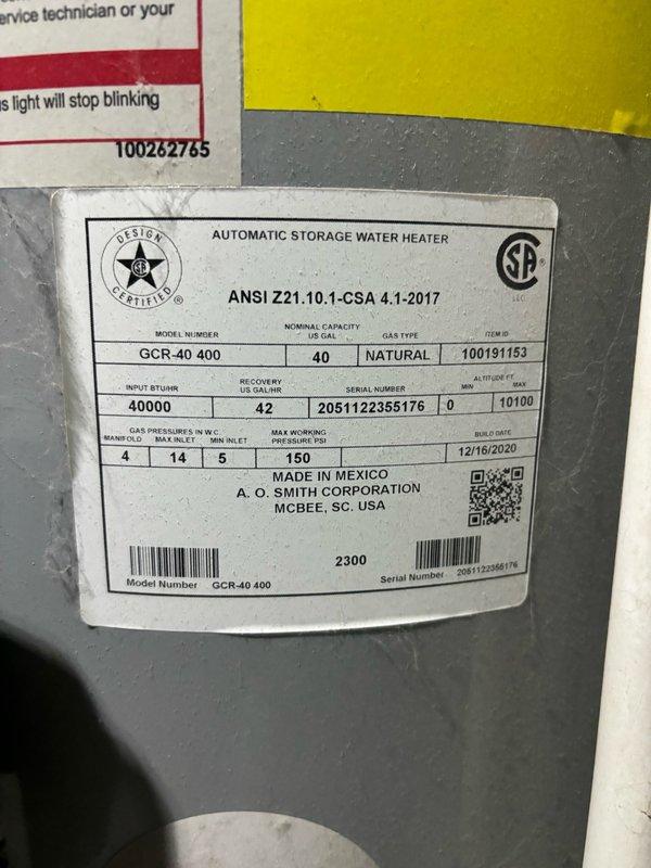 Responded to service call for water heater with pilot light out in garage. Upon arrival, inspected A.O. Smith 40-gallon natural gas water heater (Model GCR-40 400, manufactured 12/2020). Examined Resideo gas control valve and verified pilot was extinguished. Checked gas supply line for proper pressure and confirmed adequate flow. Followed manufacturer lighting procedure by turning control knob to pilot position, depressing igniter button while holding knob down until pilot ignited, then released knob once status light indicated proper operation. Verified pilot flame stability and adjusted as needed. Cycled main burner to confirm proper ignition sequence and flame characteristics. Inspected thermocouple/thermopile connections and verified adequate voltage generation. Confirmed gas control valve status light showed normal operation code. Unit restored to full operational status with hot water production capability confirmed.