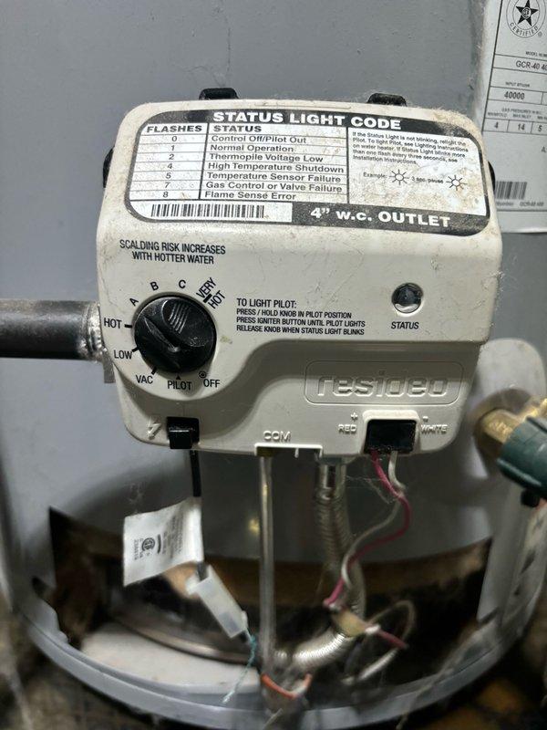 Responded to service call for water heater with pilot light out in garage. Upon arrival, inspected A.O. Smith 40-gallon natural gas water heater (Model GCR-40 400, manufactured 12/2020). Examined Resideo gas control valve and verified pilot was extinguished. Checked gas supply line for proper pressure and confirmed adequate flow. Followed manufacturer lighting procedure by turning control knob to pilot position, depressing igniter button while holding knob down until pilot ignited, then released knob once status light indicated proper operation. Verified pilot flame stability and adjusted as needed. Cycled main burner to confirm proper ignition sequence and flame characteristics. Inspected thermocouple/thermopile connections and verified adequate voltage generation. Confirmed gas control valve status light showed normal operation code. Unit restored to full operational status with hot water production capability confirmed.