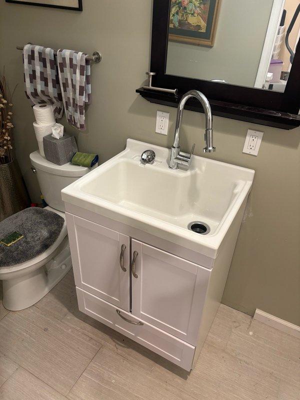 Removed existing toilet and installed customer-supplied replacement unit with new wax ring and supply line, then hauled away old fixture. Removed existing lavatory sink and installed customer-supplied utility sink, including new P-trap installation, faucet and drain assembly connection, and wall mounting for stability. All plumbing connections were tested and inspected to confirm proper drainage and verify no leaks upon completion.