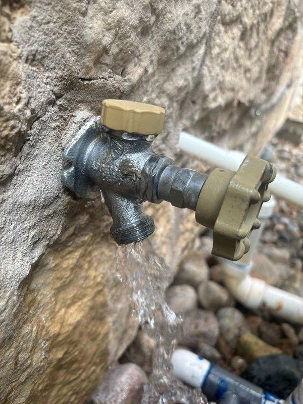 Responded to service call for non-operational sump pump caused by tripped breaker, resulting in 4 inches of standing water in basement area. Reset breaker and restored power to sump pump system, verified proper operation and water discharge. Inspected and assessed exterior water spigot that sustained freeze damage during recent cold weather event, confirmed burst fitting requiring replacement. Documented mechanical room conditions including water heaters, HVAC equipment, and plumbing infrastructure for service records.
