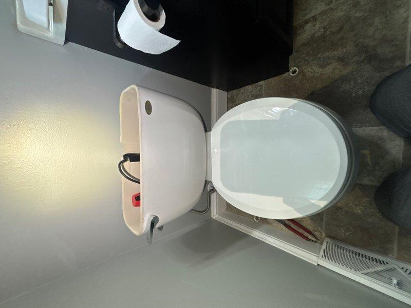 Installed new Toto Drake toilet in bathroom, including new wax ring seal and supply stop valve. Completed all necessary plumbing connections with braided stainless steel supply line, ensuring proper water flow and leak-free operation.