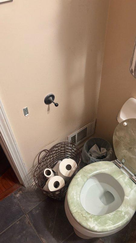 Removed and replaced cracked and corroded drain line serving bathroom sink and toilet. Removed toilet to access damaged piping, cut back to solid cast iron, and connected using approved flexible couplings. Installed 3-inch PVC for toilet connection and transitioned to 2-inch PVC for bathroom sink drain and vent. Cut access opening in back of sink cabinet to tie into existing cast iron vent stack. Reset toilet with new closet bolts and wax ring. Replaced 1 1/4-inch P-trap at lavatory. Secured all new PVC piping with plumber's strap and tested system for proper pitch, drainage, and leaks. Additionally, installed Badger 5 garbage disposal unit, hard-wired to existing electrical connection without power cord per specifications. All work completed to code and tested for proper operation.