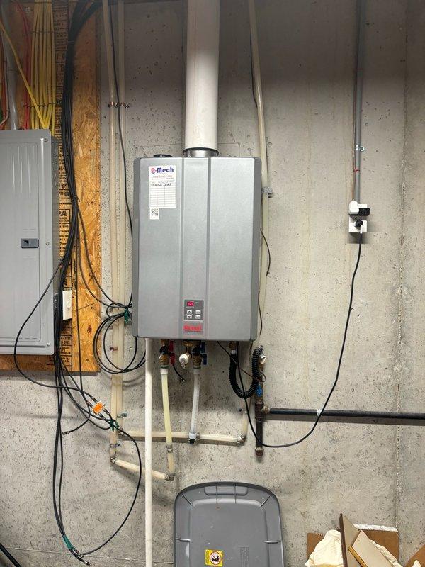 Responded to service call for inconsistent hot water production with intermittent temperature display readings of 12-14 degrees. Upon inspection, discovered customer had tankless water heater unit (Efitech brand) installed in basement utility area, not a tanked water heater as initially categorized. Performed diagnostic evaluation of tankless unit including examination of internal heat exchanger assembly, gas valve connections, and electrical control board. Verified proper venting through PVC exhaust system and confirmed adequate electrical supply from dedicated panel. Inspected brass gas line fittings and flow sensor components for proper operation. Documented equipment condition and installation configuration with photos showing unit mounting, plumbing connections, electrical wiring, and internal mechanical components. Identified potential issues with temperature sensor or control board causing erratic temperature readings and inconsistent heating cycles. Provided customer with findi
