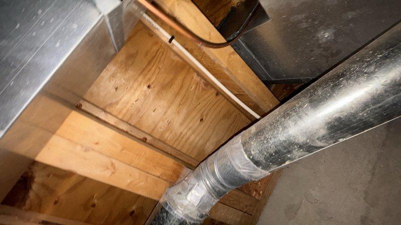 Conducted on-site evaluation for pot filler installation in kitchen. Assessed existing plumbing infrastructure including copper supply lines in attic/crawl space and determined optimal routing path for new water line connection. Documented current mechanical space conditions and identified installation requirements for wall-mounted pot filler fixture above cooking surface.
