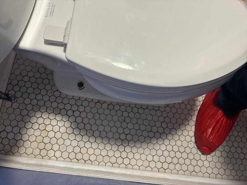 Responded to service call for toilet wax seal replacement in residential bathroom. Upon arrival, removed toilet from floor flange to access deteriorated wax ring. Inspection revealed heavily corroded closet bolts and mounting hardware requiring replacement due to advanced rust and oxidation. Cleaned toilet base mounting surface and floor flange, removing old wax residue. Installed new wax ring, replaced corroded closet bolts with new stainless steel hardware, and properly reset toilet to floor flange. Verified secure mounting, tested flush operation, and confirmed proper seal with no leaks detected.
