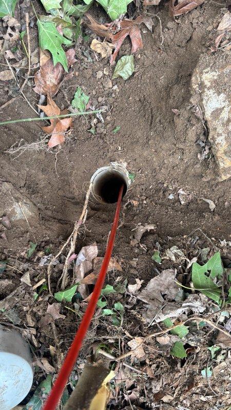 Responded to service call for damaged sewer cleanout and pipe caused by fallen tree. Upon arrival, conducted visual inspection of the affected area and identified a broken cleanout cap and cracked pipe at ground level. Utilized camera inspection equipment to assess the extent of internal pipe damage and verify the structural integrity of the surrounding sewer line. Documented all findings with photographic evidence showing the damaged cleanout assembly and camera feed of pipe interior condition. Provided comprehensive repair quote for cleanout cap replacement and cracked pipe section repair to restore proper system functionality.