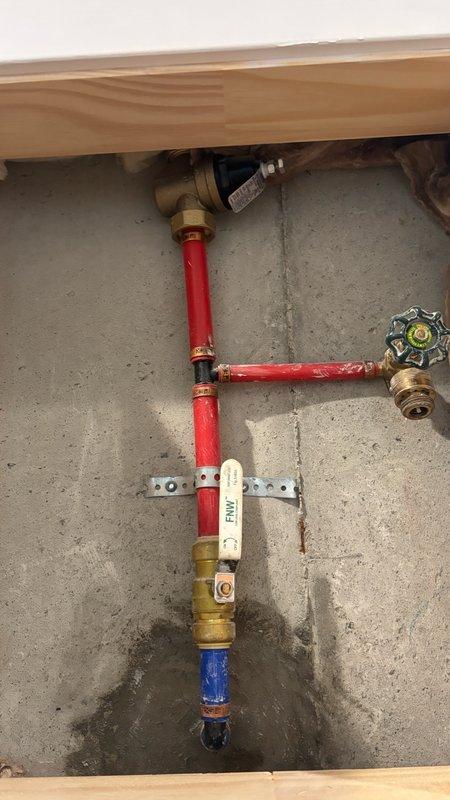 Conducted on-site assessment for water filtration system installation in residential property undergoing renovation. Evaluated existing plumbing infrastructure, including PEX supply lines with hot and cold water distribution configured in T-assembly with brass fittings and shut-off valves. Documented installation area featuring exposed framing and identified optimal mounting location for water treatment equipment. Photographed current plumbing configuration and prepared comprehensive estimate for whole-house water filtration system integration with existing supply lines.