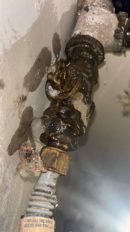 Responded to gas leak report behind water heater identified by HVAC technician. Upon inspection, discovered heavily corroded gas pipe assembly with extensive rust deterioration throughout multiple connection points and valve fittings. The corrosion had compromised the integrity of the piping system, creating a hazardous leak condition. Removed and replaced the failed corroded pipe assembly, including deteriorated brass fittings, threaded unions, and valve connections. Installed new gas-rated piping and fittings to restore safe gas delivery to the water heater. Performed pressure test on completed installation to verify system integrity and confirm no leaks present. Restored gas service and verified proper operation of water heater.