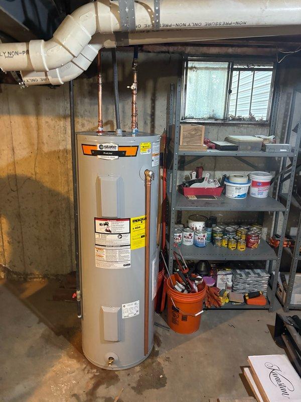 Installed a new 50-gallon State brand electric water heater in basement utility area. Connected copper supply lines to existing plumbing system with proper soldered joints, installed pressure relief valve with discharge piping, and completed all electrical connections per manufacturer specifications and local code requirements.