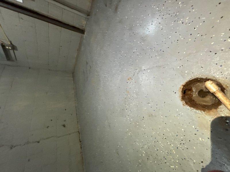 Performed secondary assessment of existing sewer line following initial scope report indicating extensive damage with multiple cracks and compromised sections throughout the system. Conducted visual inspection of accessible plumbing infrastructure including basement utility area where main sewer line penetrates foundation floor. Documented copper piping configuration and noted water staining patterns around floor penetration point suggesting potential moisture intrusion issues. Evaluated exterior pathway area along suspected sewer line route to identify surface indicators of subsurface pipe deterioration. Reviewed scope findings and provided professional opinion on condition assessment and recommended repair options for damaged sewer infrastructure.