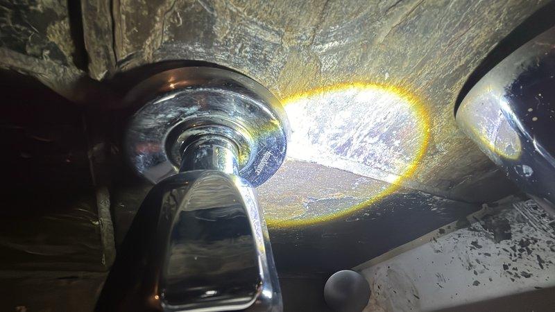 Responded to emergency call for leaking bathroom shower faucet. Upon inspection, identified worn valve cartridge and deteriorated seals as source of leak. Removed existing faucet assembly, replaced faulty cartridge and associated gaskets, and reinstalled components. Tested water flow and pressure at both hot and cold settings to verify proper operation and confirm leak was fully resolved. Inspected surrounding plumbing connections under fixture for any additional moisture issues or potential concerns. All components functioning correctly with no active leaks detected upon completion.