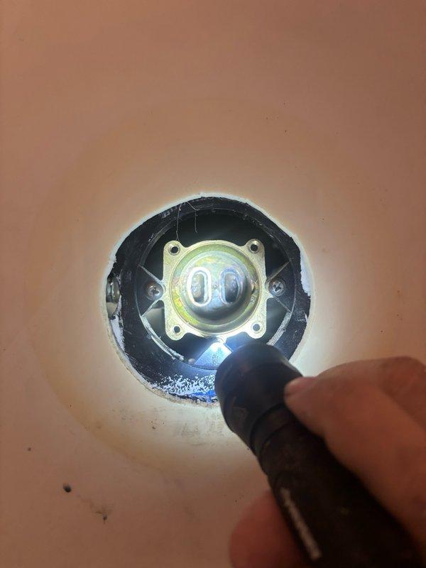 Responded to service call for shower cartridge replacement in primary bedroom bathroom. Accessed shower valve assembly through wall opening, removed existing cartridge from brass mounting plate, and installed new replacement cartridge. Verified proper operation of shower controls and water flow upon completion.