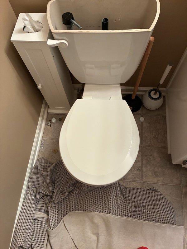 Responded to reported leak at toilet base in second floor guest room. Upon inspection, identified water seepage originating from deteriorated wax ring seal between toilet fixture and closet flange. Shut off water supply at angle stop valve and drained toilet tank and bowl completely. Disconnected water supply line and removed closet bolts securing toilet to flange. Lifted and removed toilet fixture to access mounting area.

Removed old wax ring and cleaned both toilet horn and closet flange surfaces of residual wax and debris. Inspected closet flange for damage and verified proper condition and secure mounting to subfloor. Installed new wax ring with integrated polyethylene flange onto toilet horn. Carefully repositioned toilet over closet flange, ensuring proper alignment with mounting bolts. Compressed wax seal by applying even downward pressure while checking level of fixture. Installed new brass closet bolts with washers and nuts, tightening in alternating pattern to manufacturer s