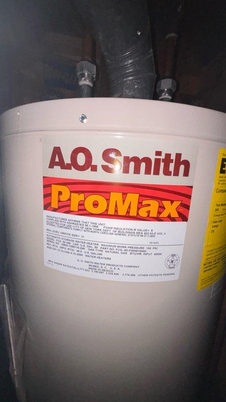 Performed routine maintenance flush on A.O. Smith ProMax tanked water heater located in basement mechanical area. Drained sediment buildup from tank, inspected inlet and outlet connections, verified proper operation of temperature and pressure relief valve, and checked all copper supply line connections for leaks or corrosion. Unit returned to normal operation with improved efficiency.