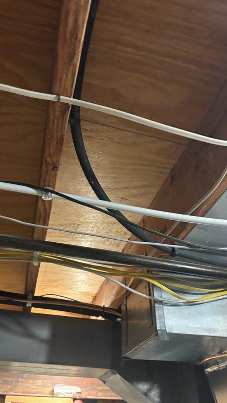 Completed diagnostic inspection and provided repair estimate for gas line relocation in attic/ceiling space. Assessed existing gas line routing through exposed framing alongside electrical conduits, PVC lines, and HVAC ductwork to determine optimal relocation path and feasibility for same-day completion.