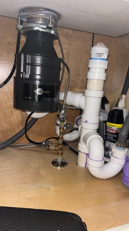 Performed camera inspection of drain line with video recording to assess pipe condition and identify any blockages or structural issues. Successfully installed customer-supplied garbage disposal unit under kitchen sink, connecting electrical supply and integrating unit with existing PVC drain assembly. All plumbing connections tested and verified leak-free upon completion.