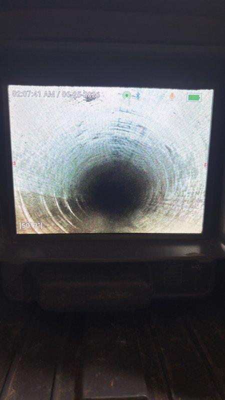 Performed camera inspection of drain line with video recording to assess pipe condition and identify any blockages or structural issues. Successfully installed customer-supplied garbage disposal unit under kitchen sink, connecting electrical supply and integrating unit with existing PVC drain assembly. All plumbing connections tested and verified leak-free upon completion.