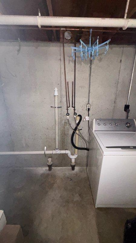 Relocated laundry drain line in basement utility area by cutting and removing existing drain configuration, capping off original connection point, and installing new 2-inch PVC drain line along concrete foundation wall. Routed new drain line with proper pitch and reconnected to existing kitchen drain line using appropriate fittings and elbow joints. Tested system for proper flow and verified all connections were leak-free upon completion.