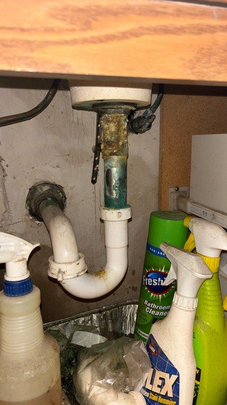 Responded to service call for bathroom faucet that would not shut off on main level. Upon inspection, identified severely corroded and deteriorated shut-off valve and supply line connections beneath sink. Replaced faulty valve assembly and corroded metal tailpiece showing extensive oxidation and mineral buildup. Installed new supply lines and P-trap components to ensure proper function and prevent future leaks. Tested faucet operation and verified complete shut-off capability restored with no active drips or leaks.