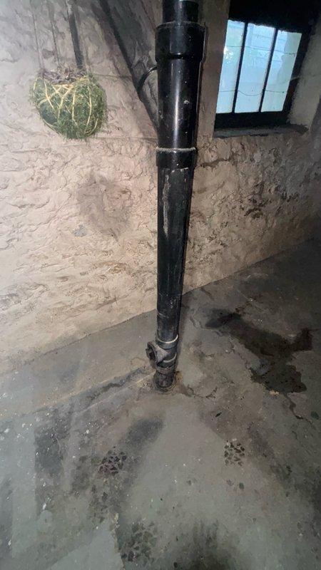 Responded to service call for backed-up dishwasher water line in kitchen area. Upon inspection, accessed crawl space and basement utility area to locate and assess the drainage system. Identified blockage in the dishwasher drain line and cleared obstruction using appropriate plumbing tools. Inspected associated drainage pipes, including vertical PVC drain stack and copper supply lines, to ensure proper flow and verify no additional issues with the water treatment or drainage system. Tested dishwasher water line for proper drainage and confirmed system restored to normal operation.