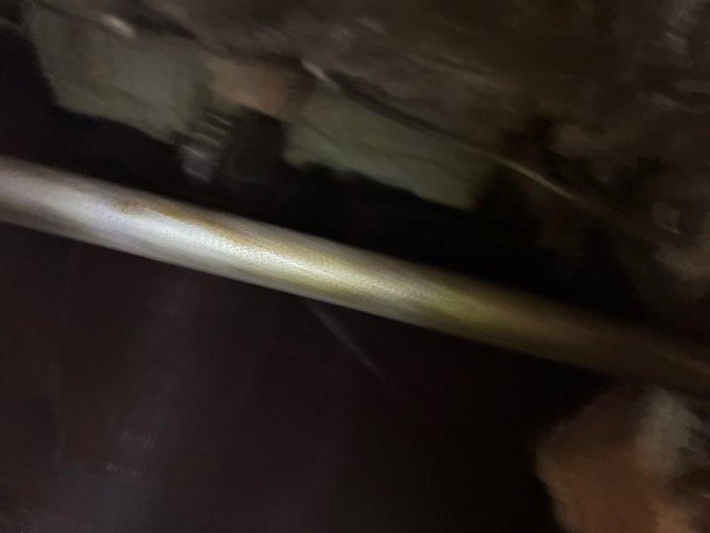 Responded to service call for gas line replacement after gas supply was shut off due to safety concerns. Conducted diagnostic assessment in crawl space area to evaluate existing gas piping system and determine scope of replacement work. Inspected metallic gas line routing beneath floor structure, examining pipe condition, connections, and accessibility for replacement. Documented existing installation configuration including pipe location relative to floor joists and structural members. Prepared estimate for complete gas line replacement to restore safe gas service to the property.