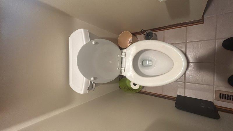 Responded to service call for replacement of three aging toilets throughout the residence. Upon arrival, assessed existing fixtures at two upstairs bathroom locations and one downstairs bathroom. All three toilets showed signs of age-related wear and were due for replacement. Removed existing toilet units from their floor flanges, inspecting wax ring seals and flange conditions at each location. Verified that drain connections and water supply lines were in acceptable condition for new installations. Installed three new toilet assemblies, ensuring proper sealing with new wax rings and secure mounting to floor flanges. Connected water supply lines and tested each unit for proper fill, flush function, and leak-free operation. Verified all installations met code requirements and functioned correctly before completing the service call.