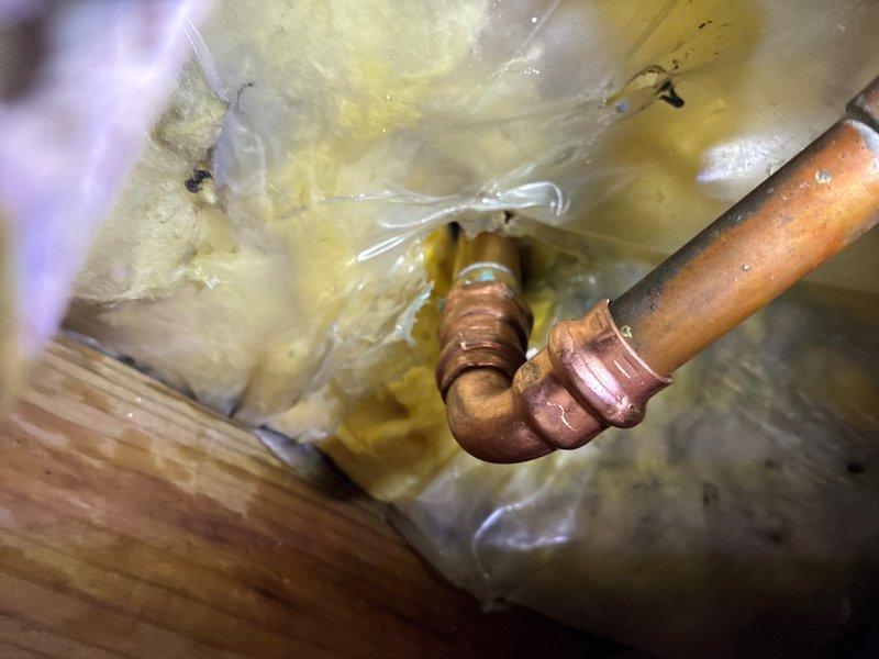 Completed repair of exterior faucet damaged by winter freeze conditions. Accessed copper supply line within insulated wall cavity, removed damaged section of pipe, and installed new brass fitting with proper thread sealant. Replaced freeze-damaged components and restored water supply to exterior hose bib, ensuring proper function and leak-free operation.