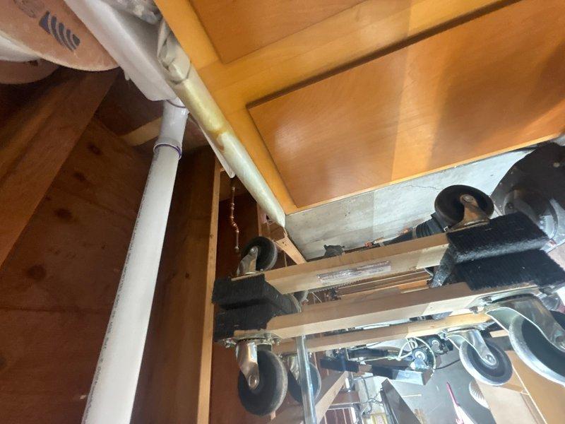 Performed annual maintenance on tankless water heater system in basement of 60-year-old residential property. Inspected unit for proper operation, flushed system to remove mineral buildup and scale deposits, checked all connections and fittings for leaks, and verified proper venting. Cleaned inlet filter screen and tested flow rates to ensure optimal performance and efficiency of the tankless system.