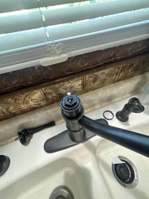 Responded to kitchen faucet leak. Disassembled MOEN faucet assembly, removed faulty valve cartridge, and replaced with new cartridge. Reassembled faucet components including handle, spout connection, and mounting hardware. Tested for proper operation and verified leak was eliminated.