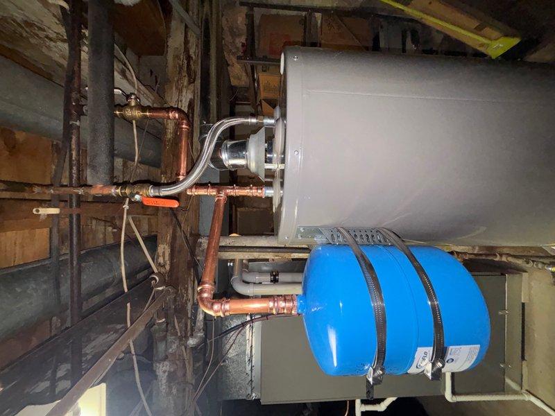 Installed a new thermal expansion tank on the water heater system to protect against excessive pressure buildup caused by thermal expansion. The expansion tank was properly mounted and connected to the cold water supply line using appropriate brass fittings and flexible connectors. Additionally, installed a new pressure reducing valve (PRV) on the main water supply line entering the structure to regulate incoming water pressure and protect the plumbing system and fixtures from damage due to excessive municipal water pressure. Both installations were completed with proper support, secure connections, and tested for proper operation and leak-free performance.