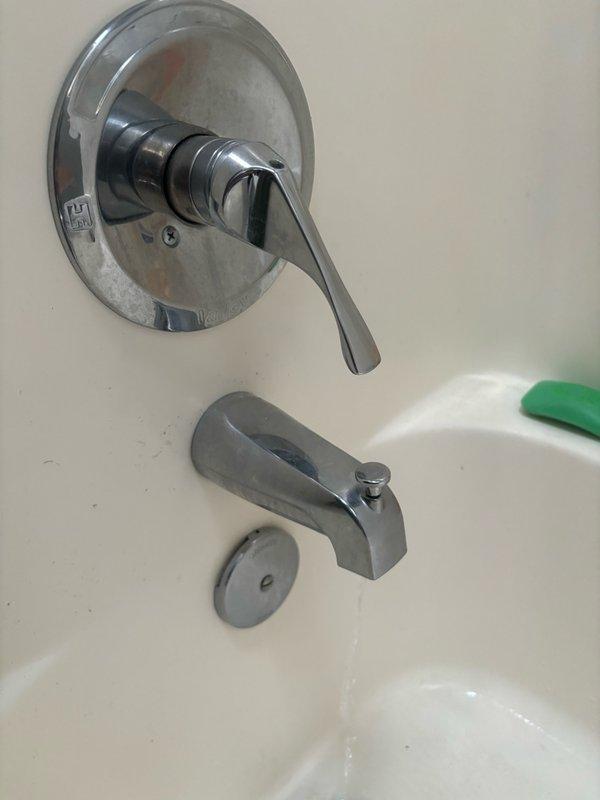 Responded to upstairs bathroom for faucet that would not shut off, resulting in constant running water. Inspected single-handle tub and shower control valve with chrome trim. Diagnosed faulty cartridge in control valve assembly preventing proper water shutoff. Removed handle and trim plate, extracted worn cartridge, and installed replacement cartridge compatible with existing fixture. Tested operation through multiple cycles to verify complete shutoff and proper flow control at all positions. Reassembled fixture with existing trim components and confirmed no leaks at connections. System restored to full functionality with proper shutoff capability.