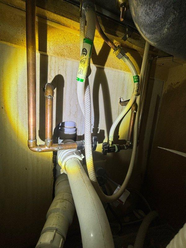 Completed scheduled preventive plumbing maintenance inspection of basement mechanical room and utility systems. Conducted comprehensive visual assessment of all accessible plumbing infrastructure, including copper water supply lines, PVC drain piping, and flexible connector hoses serving the HVAC system. Inspected water heater connections, pipe fittings, and mounting points for signs of leakage, corrosion, or deterioration. Verified proper routing and support of all piping systems. All plumbing components found to be in satisfactory working condition with no immediate repairs required. Documentation photos captured for maintenance records.