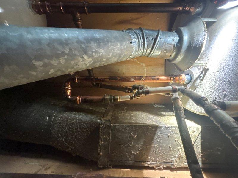 Responded to no hot water complaint at utility closet location. Upon arrival, performed diagnostic assessment of tanked water heater system and associated plumbing components. Inspected copper supply lines, brass fittings, and connections for proper operation and potential failure points. Evaluated water heater performance, checked pilot light assembly, thermocouple function, and gas valve operation. Examined venting system including galvanized ductwork for proper draft and clearances. Identified and resolved issue preventing hot water production. Tested all connections for leaks, verified proper water flow through supply lines, and confirmed restoration of hot water delivery throughout system. System returned to full operational status with all safety checks completed.
