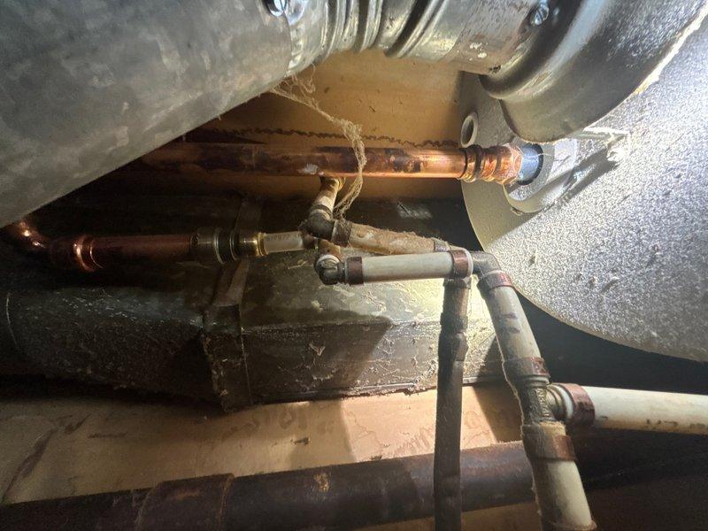 Responded to no hot water complaint at utility closet location. Upon arrival, performed diagnostic assessment of tanked water heater system and associated plumbing components. Inspected copper supply lines, brass fittings, and connections for proper operation and potential failure points. Evaluated water heater performance, checked pilot light assembly, thermocouple function, and gas valve operation. Examined venting system including galvanized ductwork for proper draft and clearances. Identified and resolved issue preventing hot water production. Tested all connections for leaks, verified proper water flow through supply lines, and confirmed restoration of hot water delivery throughout system. System returned to full operational status with all safety checks completed.