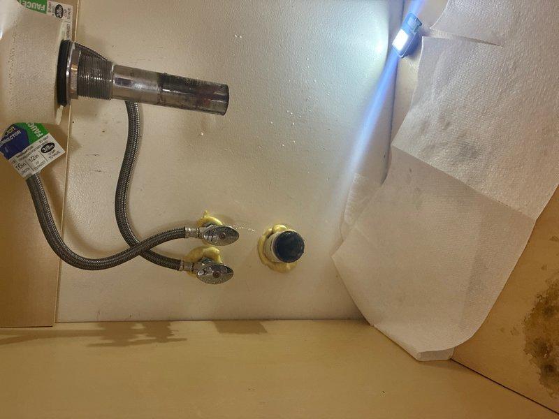 Responded to reported leak under bathroom sink on main level. Upon inspection, identified compromised connection at P-trap assembly. Replaced faulty PVC trap configuration and securing hardware. Tightened all compression fittings and verified proper seal at drain connections. Tested system under full water pressure to confirm leak elimination and proper drainage function.