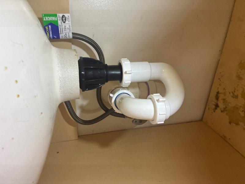 Responded to reported leak under bathroom sink on main level. Upon inspection, identified compromised connection at P-trap assembly. Replaced faulty PVC trap configuration and securing hardware. Tightened all compression fittings and verified proper seal at drain connections. Tested system under full water pressure to confirm leak elimination and proper drainage function.