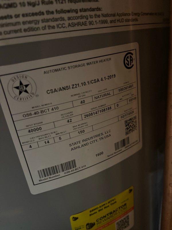 Completed installation of a 40-gallon gas water heater, model GS6 40 BCT 410, manufactured by State Industries, LLC, in residential basement utility area. Unit features 40,000 BTU input rating with 42-gallon recovery capacity and operates at 5" gas pressure, meeting CSA/ANSI Z21.10.1/CSA 4.1-2019 standards and National Appliance Energy Conservation Act requirements. Installed thermal expansion tank to protect plumbing system from excessive pressure buildup during water heating cycles. Connected copper supply and discharge piping to water heater with proper fittings and configurations. Integrated installation with existing plumbing infrastructure, including vertical and horizontal copper pipe runs throughout the mechanical space. Verified all connections for proper seal and operation. Installation completed in accordance with manufacturer specifications and applicable building codes.